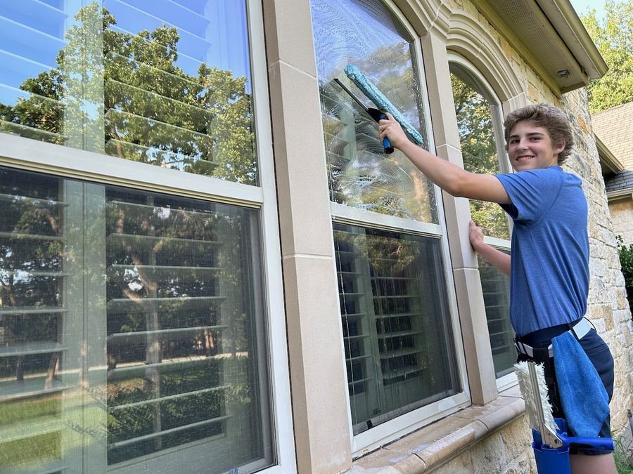 Cooper, owner of Shimmer & Shine Window Washing