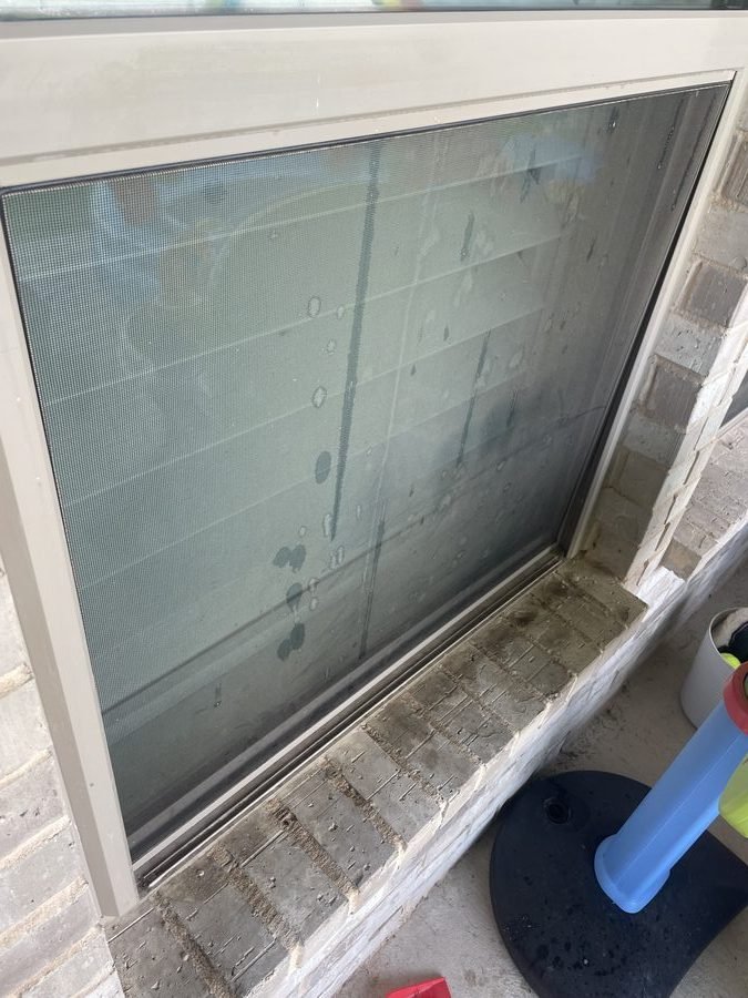 Skylight before cleaning — covered in grime and water spots